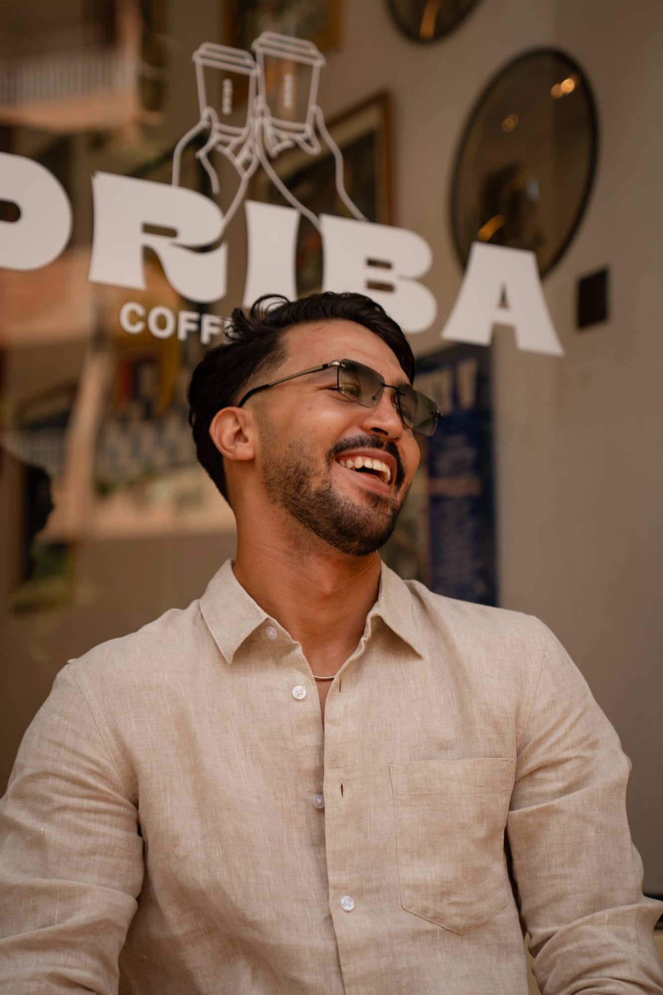 Smiling model wearing Azylis glasses for an eyewear campaign