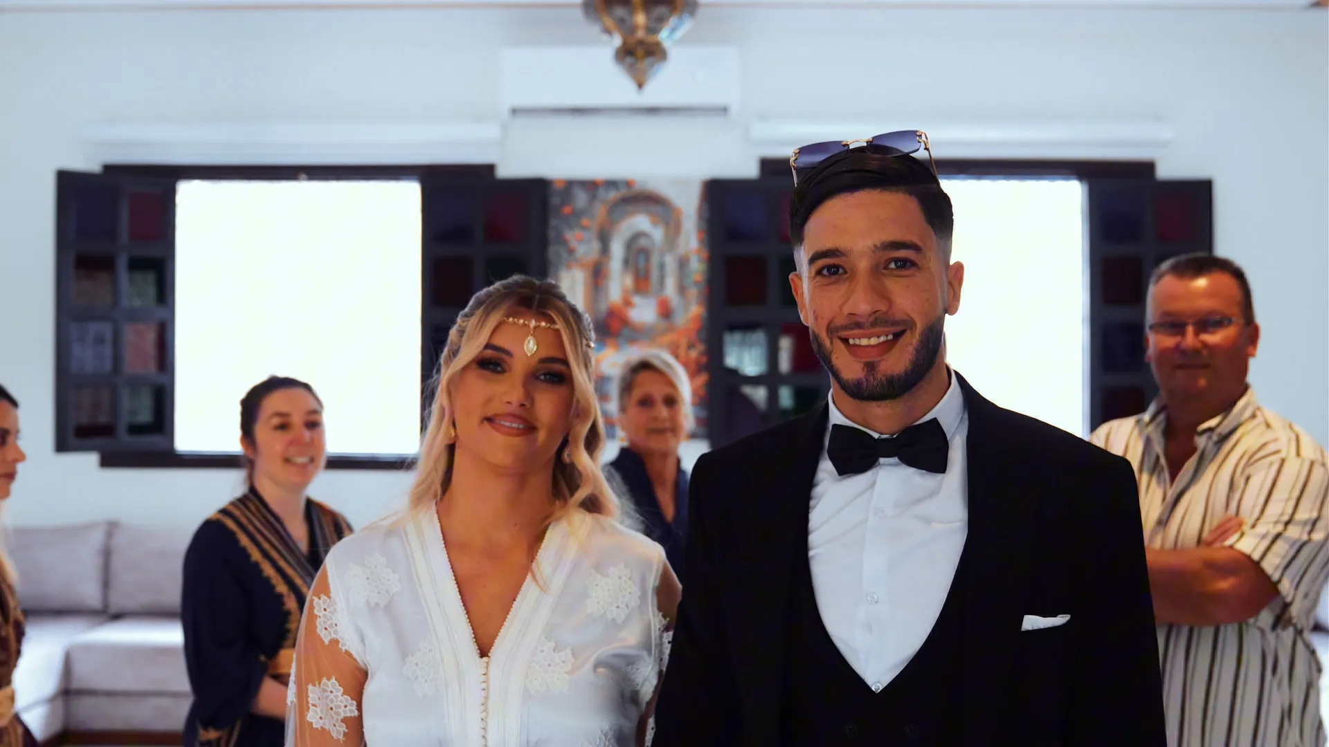 Bride and groom entering the courtyard of a riad in Marrakech